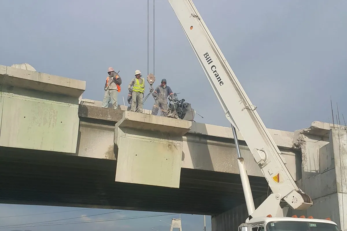 Crane removal of a cut concrete section